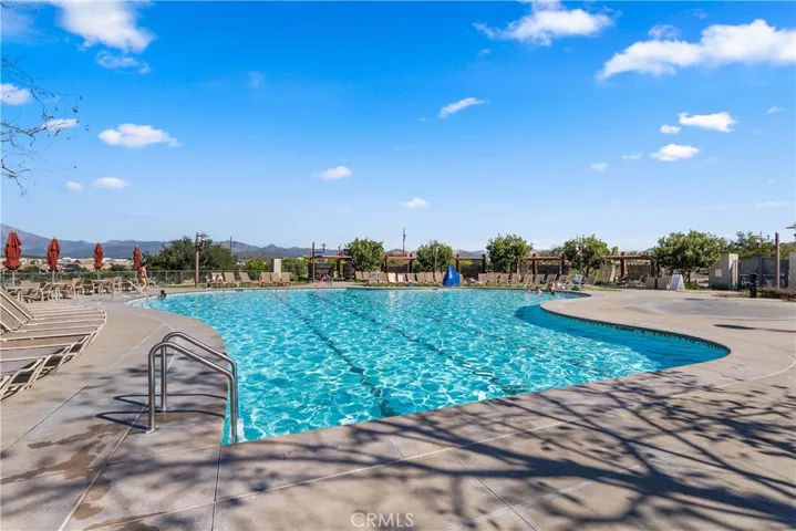 Resort-style community pool with stunning mountain and neighborhood views.