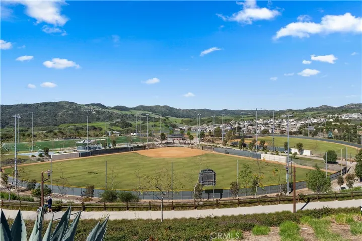Expansive community sports fields and scenic hillside views create the perfect outdoor lifestyle setting.