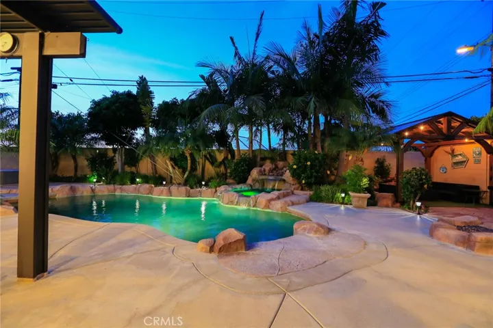 Night View of Pool and Backyard