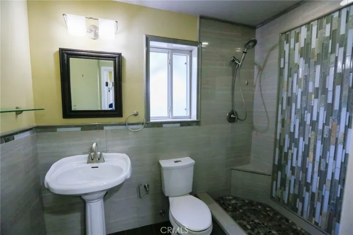 Shower and commode with sink area (image 2)
