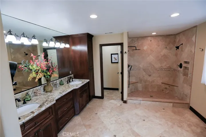Double Heads with wand in this walk-in Shower