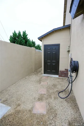 Sideyard view of small workshop. Plumbed for A/C Condensor