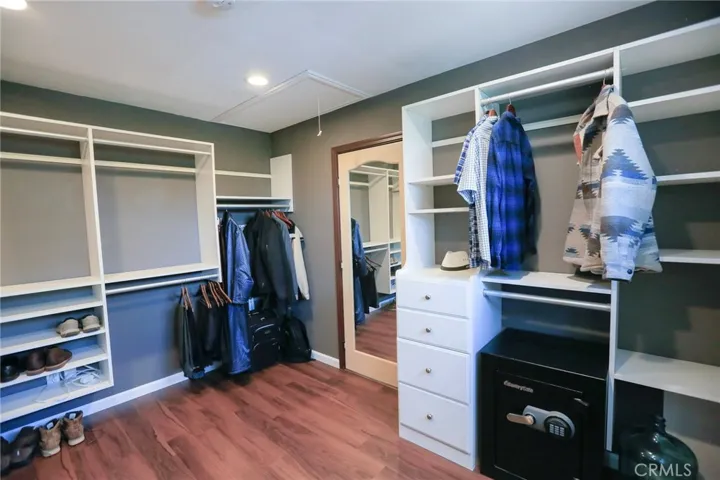 Another view from in the Closet. Attic Ladder leading to large Attic Storage