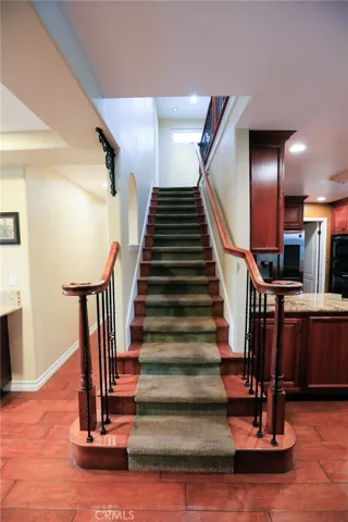 Carpeted Stairs with wood side runners