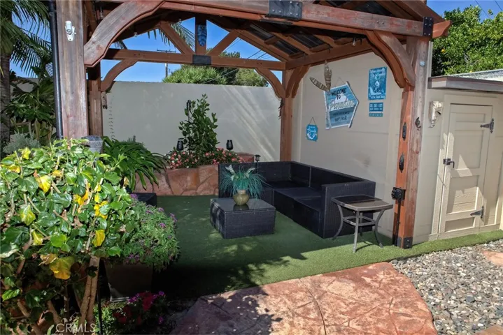 Open Barn style Gazebo with rock planter and storage