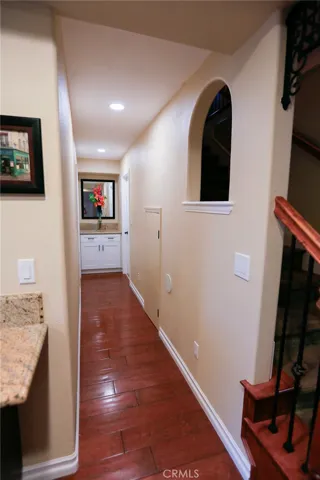 Hallway to bathroom and Downstairs room