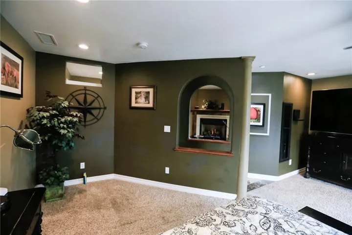 Another view of the Master Bedroom. Archways to view the Fireplace from the Bed