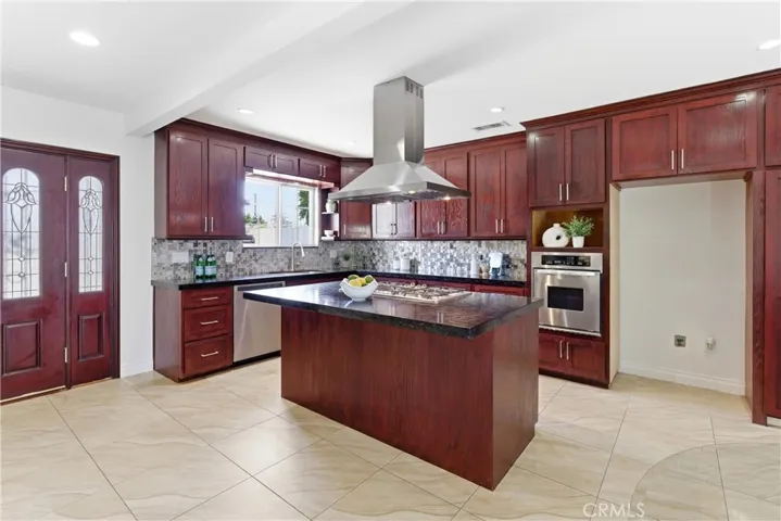 With a lovely tile flooring and ample storage, this kitchen has it all.