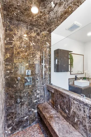 Designer tile and multiple shower head shower