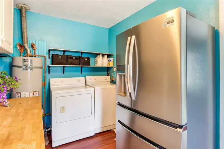 The utility room is just off the kitchen and has indoor laundry hook ups!