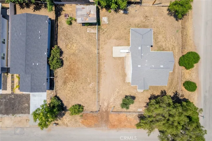 The lot is on the left and the home is on the corner lot on the right.