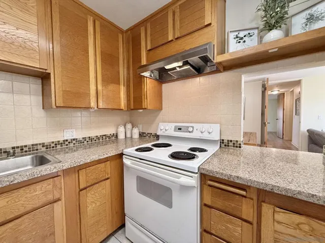 Kitchen includes a pass-through to the Dining Area