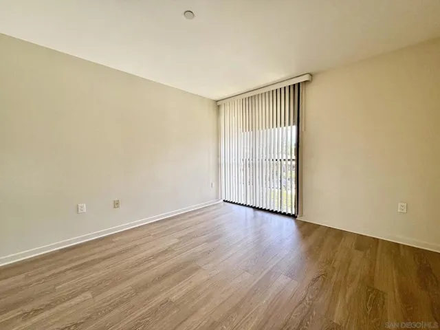 Second bedroom is also spacious and features a floor-to-ceiling window