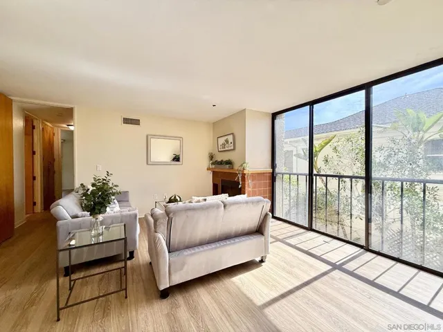 Large sliding floor-to-ceiling windows provide abundant light into the main living area.