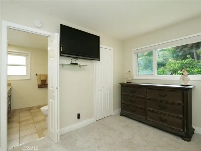 Primary Bedroom with Lush Landscape View