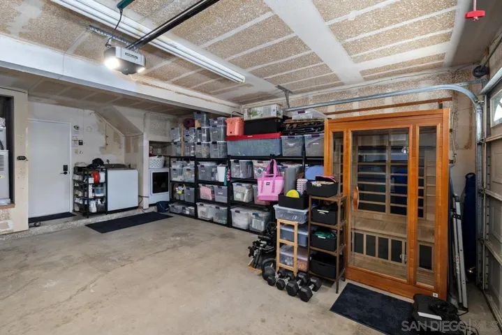 Attached direct-entry 2-car garage with storage space and laundry.