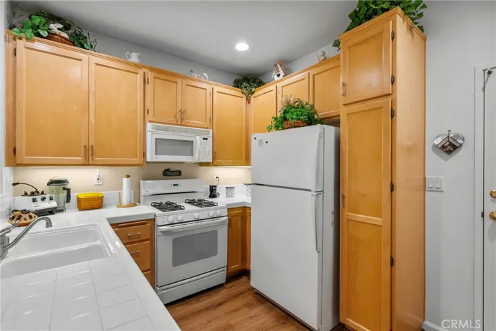 Kitchen has upgraded Maplewood cabinets