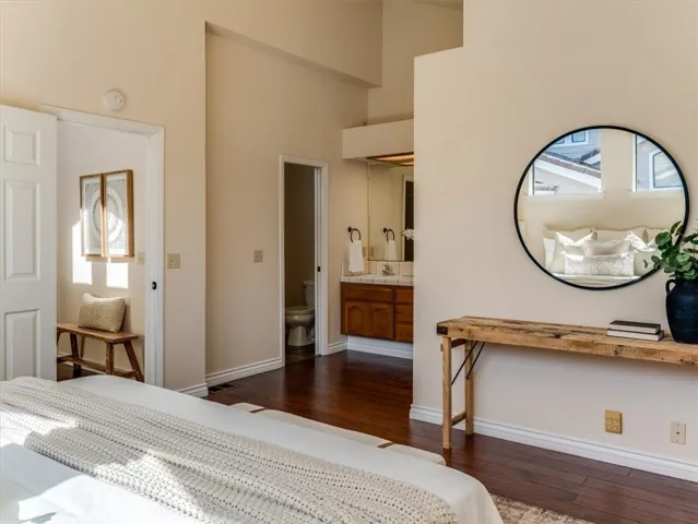 Primary suite has dual vanity, walk in closet and separate space hosting the toilet/shower.