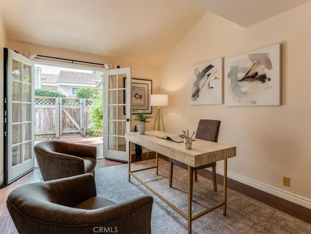 High ceilings and french doors let in natural light.