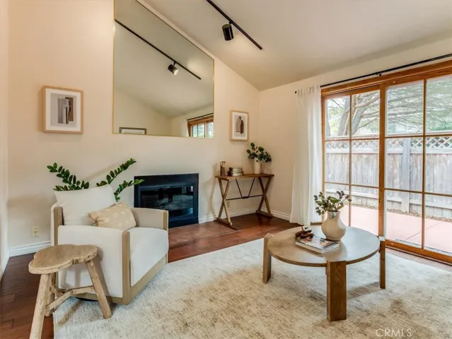 Vaulted ceilings and slider doors to the patio brighten up this living space.