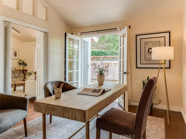 This guest space/office has french doors leading to the private patio.