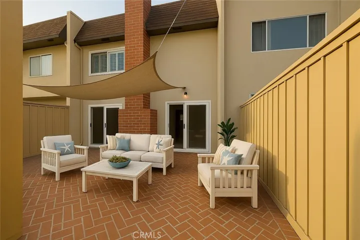Digitally staged outdoor patio between house and garage