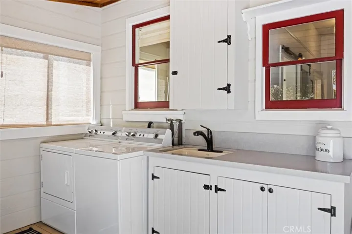 Laundry on semi-enclosed back porch.