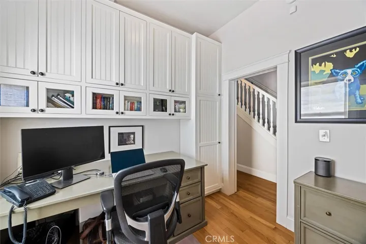 Office on primary living level with built in cabinets.