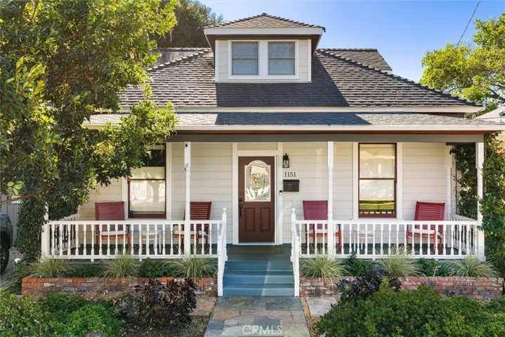 Charming entry with covered porch and low maintenance landsacping.