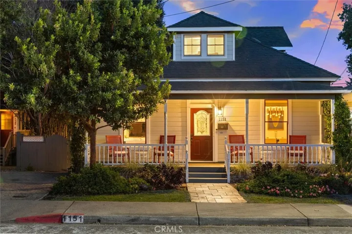 Welcoming front porch aglow in the evening.