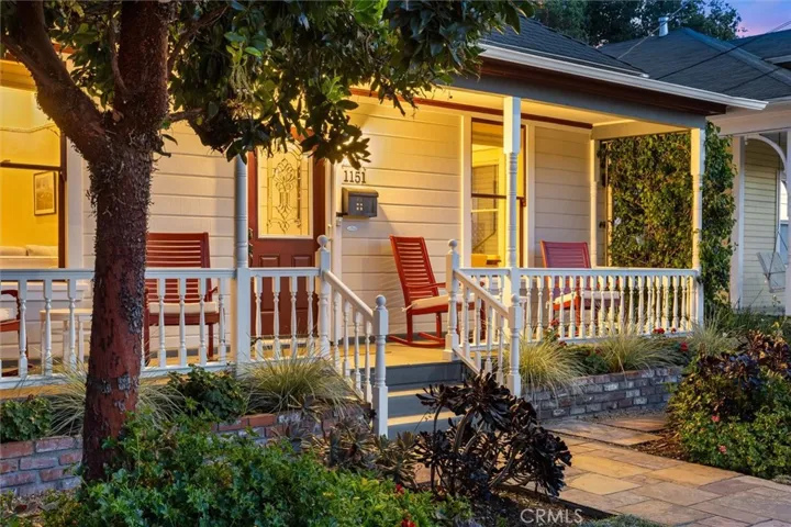 Imagine enjoying conversation with friends and a cool beverage on this porch.