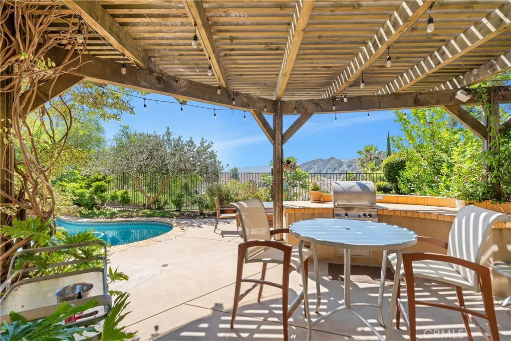 Pergola with lights and built-in barbecue