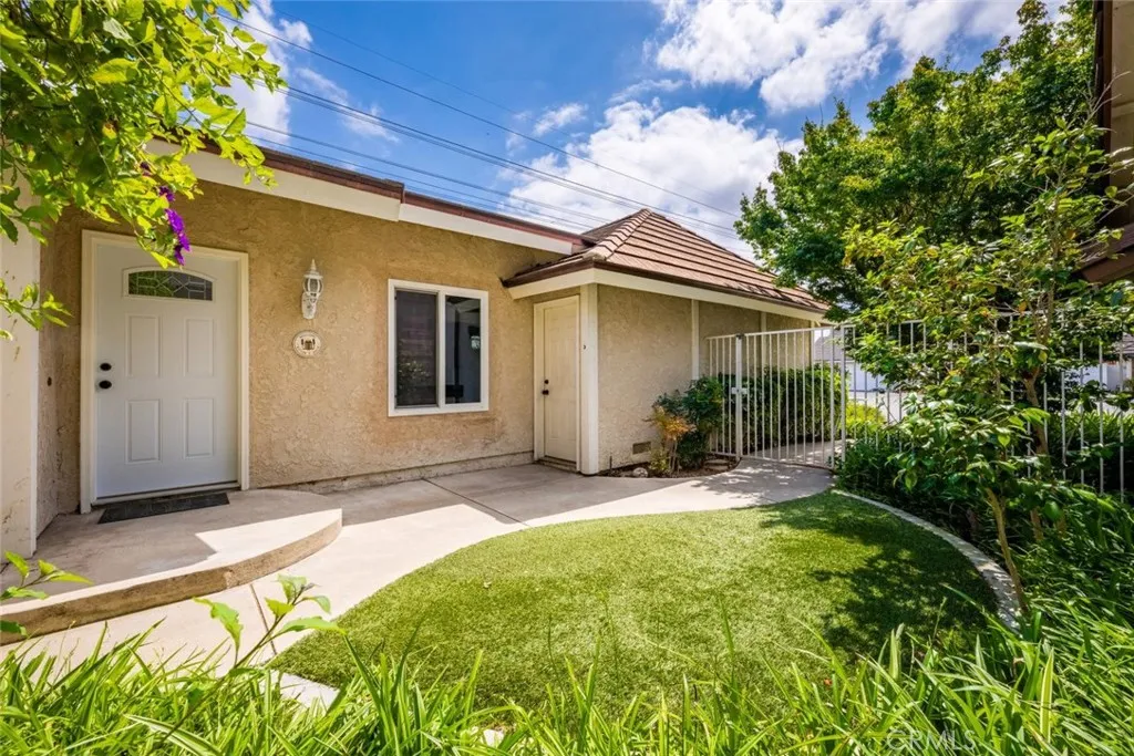 Attached garage with storage and laundry.
