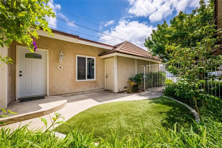 Attached garage with storage and laundry.