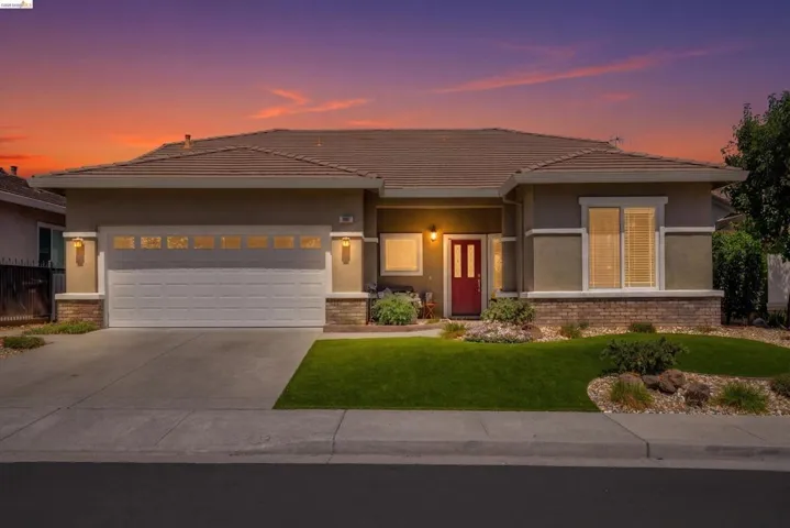 Contemporary exterior with a tiled roof and stucco finish
