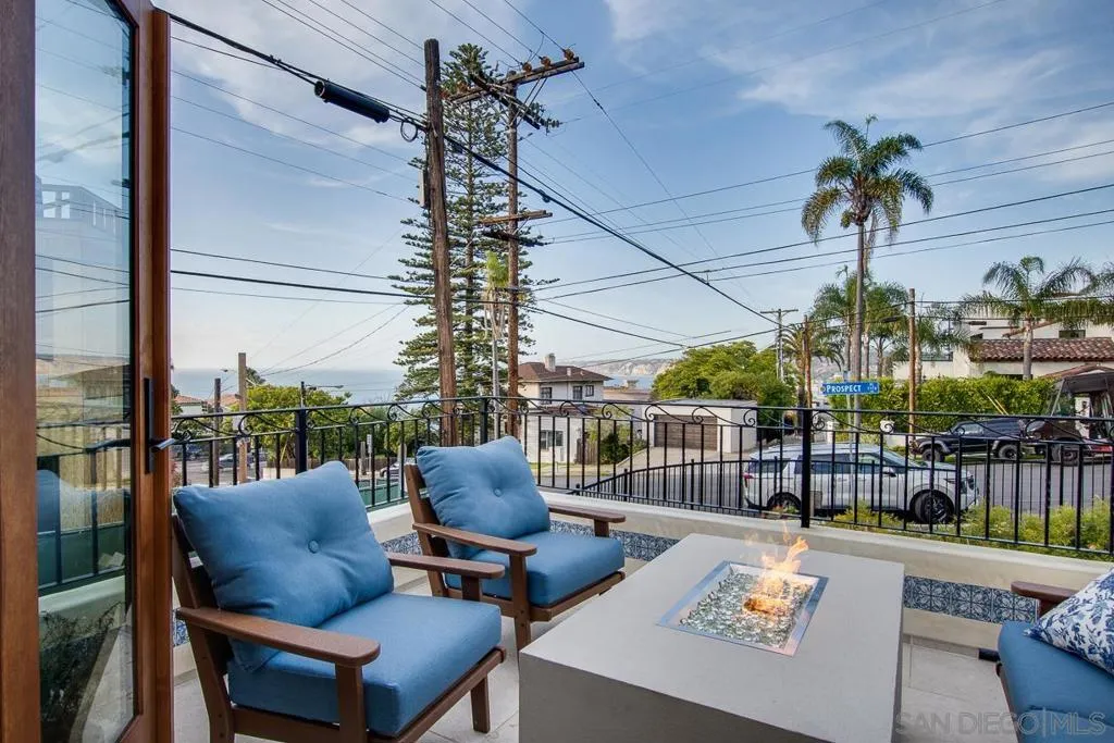 Front patio with ocean views, cozy seating a firepit.