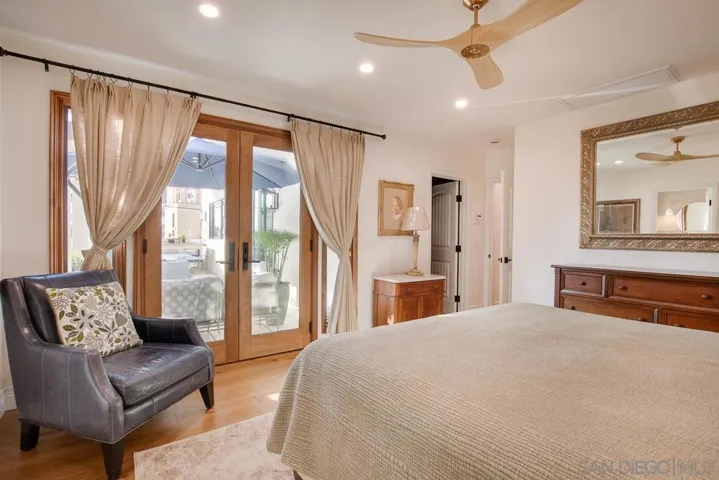 French doors out to private patio with luscious landscaping and cozy seating. Cal-King bed.