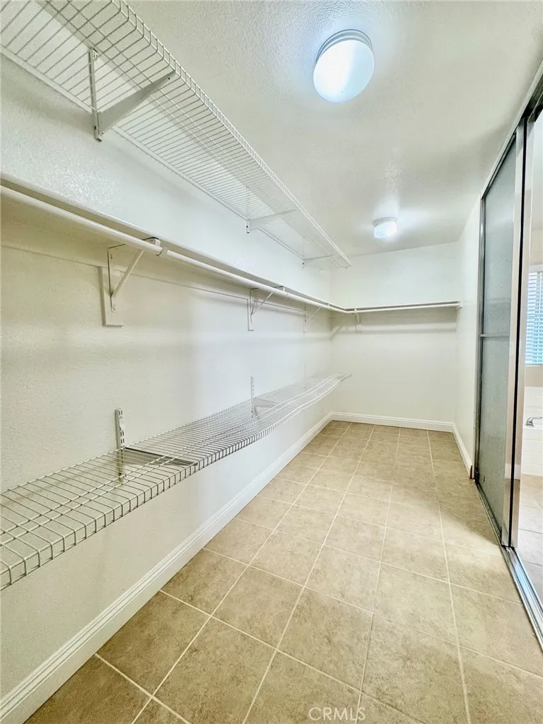 Upstairs master bed walk in closet