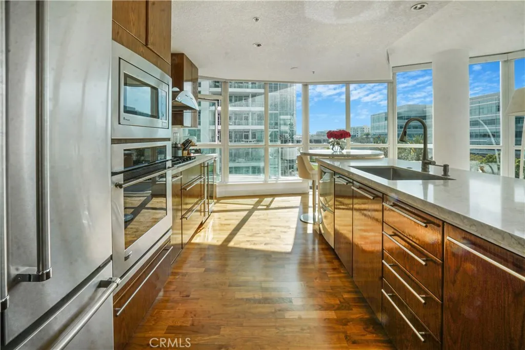 Upgraded kitchen with quartz counters and breakfast bar