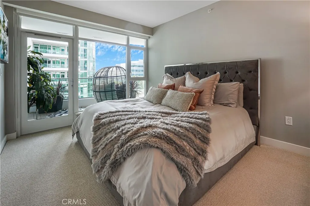 Primary bedroom with access to balcony