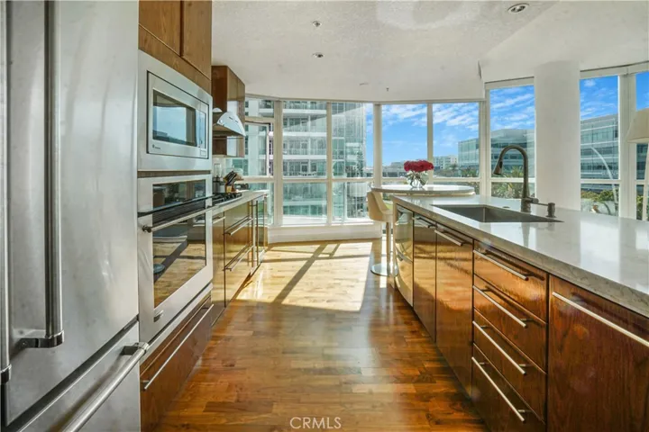 Upgraded kitchen with quartz counters and breakfast bar