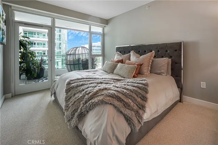 Primary bedroom with access to balcony