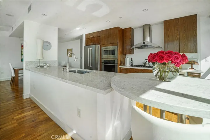 Stainless steel appliances and breakfast bar
