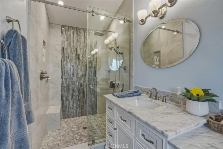 Remodeled primary bathroom with walk-in shower