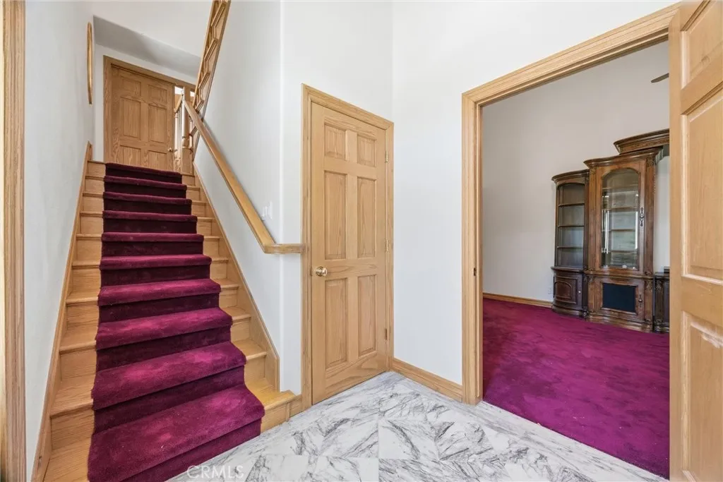 Front door entry looking up the stairs and into the bonus room