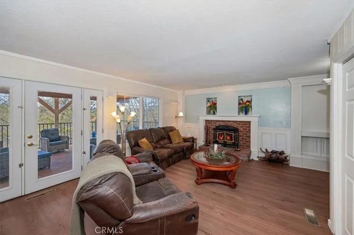 Family room with brick wood burning fireplace