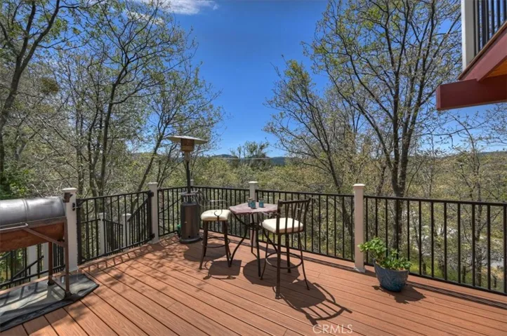 Large trex deck off the family room with a beautiful mountain view