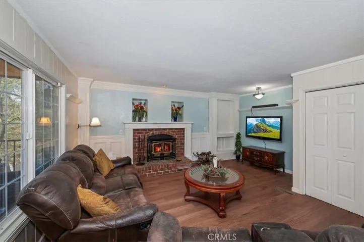 Family room with wood burning fireplace