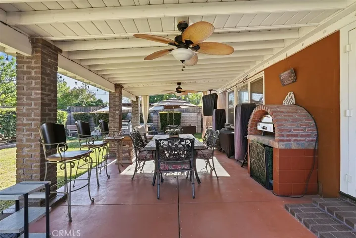 Enjoy the backyard under the covered patio with ceiling fans