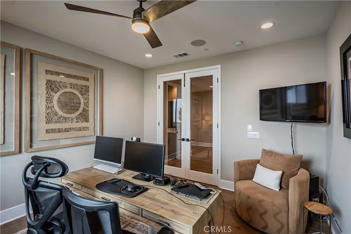 GLASS FRENCH DOORS MAKE THIS A PERFECT SPACE FOR A HOME OFFICE/DEN/GYM